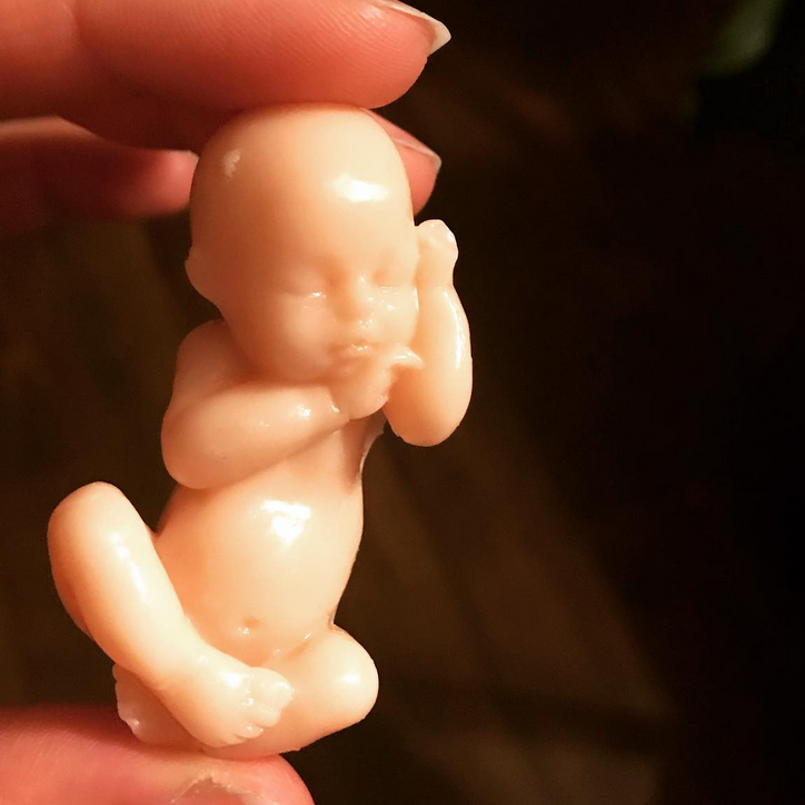 A soap molded to look like a sleeping baby.